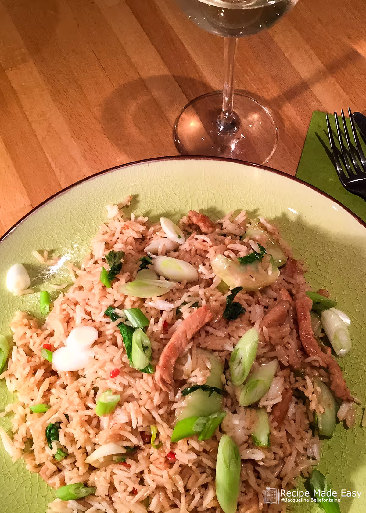 Plate of spicy rice pork with pak choi
