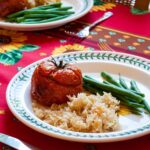 Tomato Farcie (stuffed tomatoes and rice) served with green beans