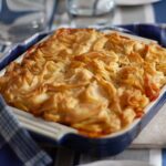 beef and tomato pie in blue dish.