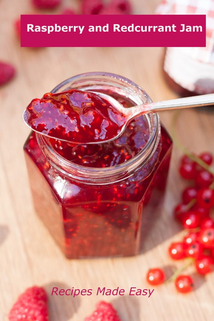 jar of raspberry and redcurrant jam with spoon on top