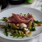 Fig and goats cheese salad on plate