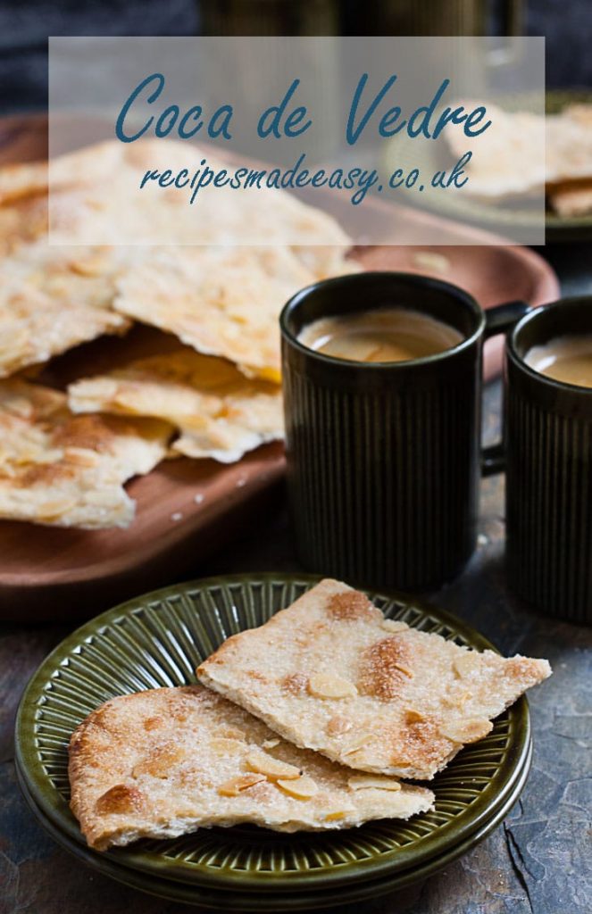 coca de vidre on a plate with coffee .