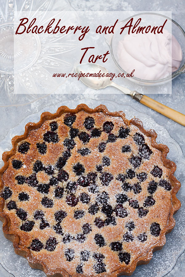 blackberry, almond and rosemary tart on a glass plate