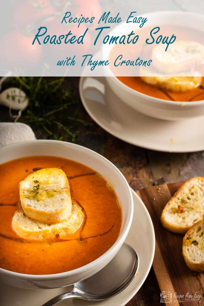 two bowls of roasted tomato soup with thyme croutons.