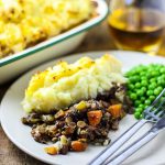 portion of vegetable and lentil bake on a plate.