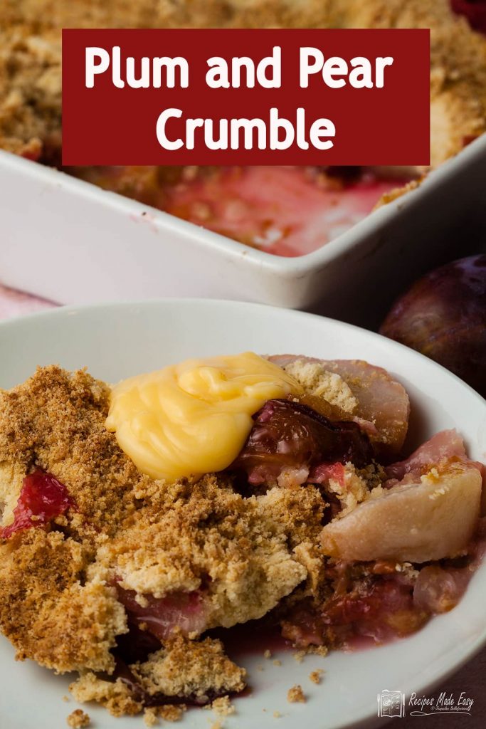 portion of plum and pear crumble with custard. Plus text overlay.