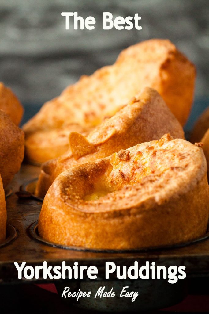 a row of yporkshire pudding in baking tin.