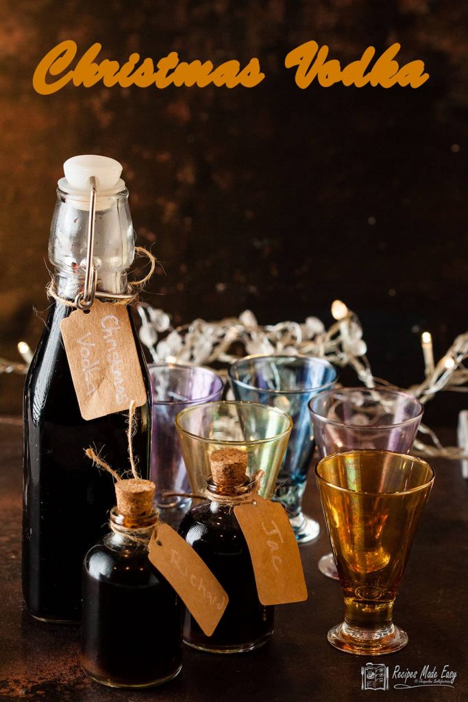 large and small bottle of Christmas vodka with shot glasses